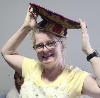 Courtney Block modeling Ethiopian basket on her head